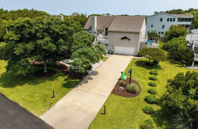 Rusty Dolphin is a well-maintained 2 level home with pool and hot tub.