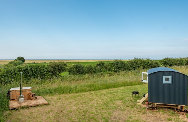 This bespoke hut is situated on the edge of the marsh with uninterrupted views out to the sea.