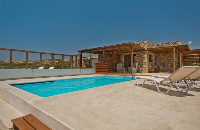 Sea Front Karpathos Apartment | Apartment Tau | Furnished Terrace | Private Swimming Pool | Shared Seating Area with with Stunning Sea Views | Michaliou Kipos