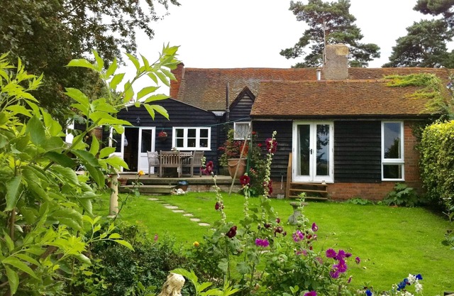Cottage de quatre cents ans avec des caractéristiques originales et des commodités modernes