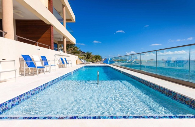 SeaDreams #8: Oceanfront Condos Near West Bay Beach w/ Jacuzzi, Pool + Rooftop Lounge