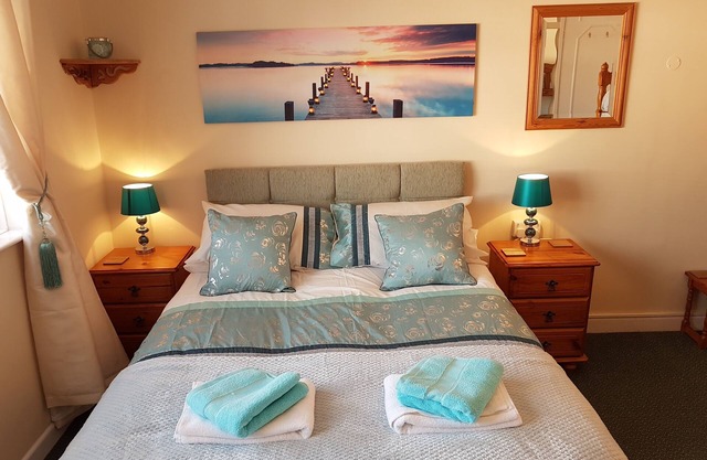 Appartement de vacances en bord de mer avec piscine d'été chauffée