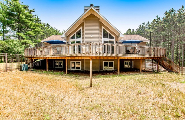 Secluded lake retreat with game room; near beach, boat rental, dining, and golf