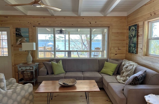 Secluded waterfront fishing cabin, boat dock, pier, sunsets, boat to beach