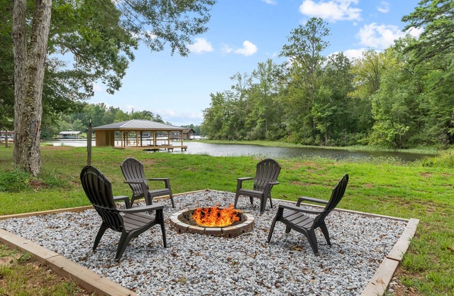 Serene Cove at Lake Sinclair on 4+ acres with Covered Deck & Covered Dock