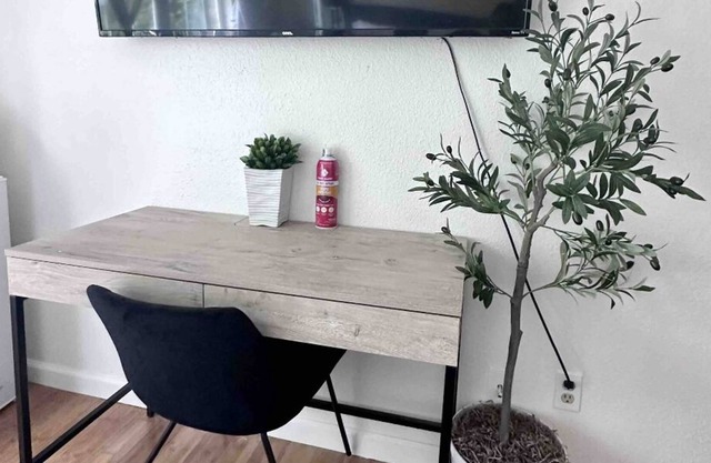 Serene room haven with private fridge, microwave, and 60” smart TV with Netflix.