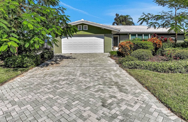 Serene waterfront retreat with a washer/dryer, central AC, private pool, & dock
