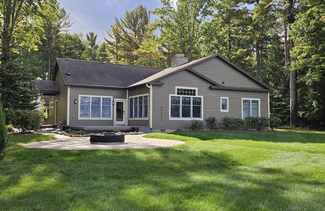 TORCH LAKE SERENITY ABOUNDS YOU IN THIS FAMILY COMPOUND