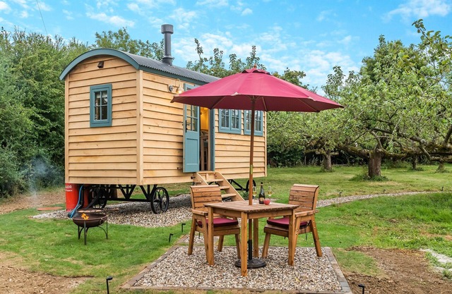 Set among the fruit trees with views of the fields.