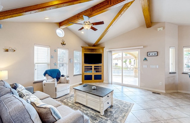 Single-level waterfront retreat with a furnished patio, AC, & washer/dryer