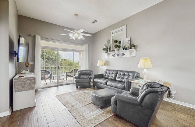 Spacious condo with water views, private balcony, & on-site pool