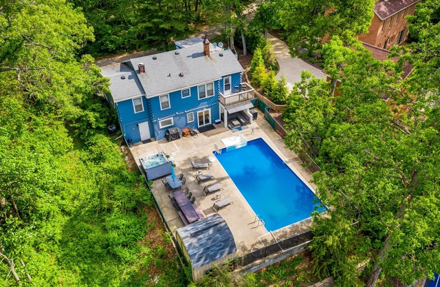 Spacious, dog-friendly home with a gas fireplace, pool, hot tub, & golf carts