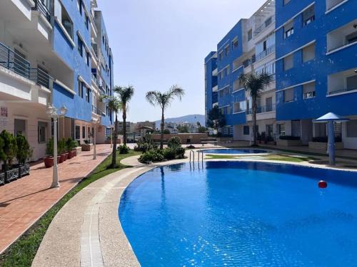 Spacious Family Apartment in Martil - Air Conditioning, Pool & Garden Views