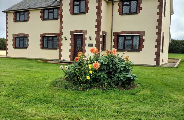 Spacious farmhouse set in countryside with far reaching views on a working farm.