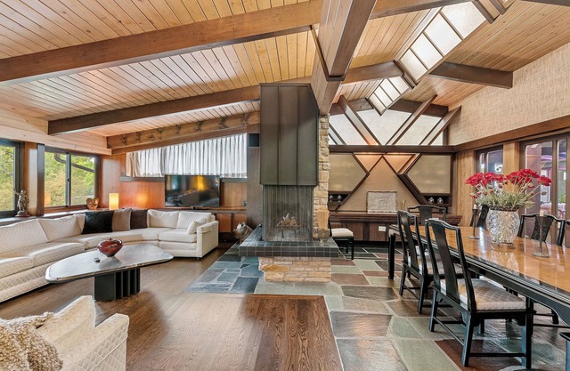 Spacious MCM home blends elegance w/ retro charm. Includes pool, steam and sauna