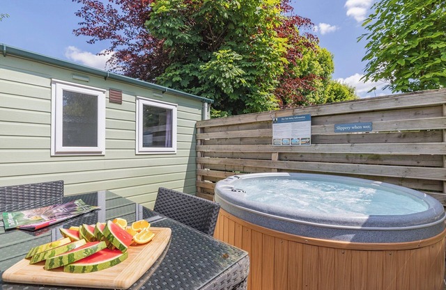 Spacious modern one-bedroom caravan exclusively for two adults with hot tub.