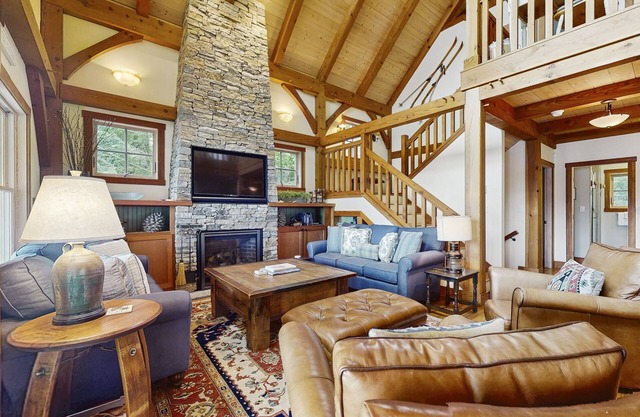 Spectacular lakefront home w/private dock, beach, swim platform, gazebo & porch