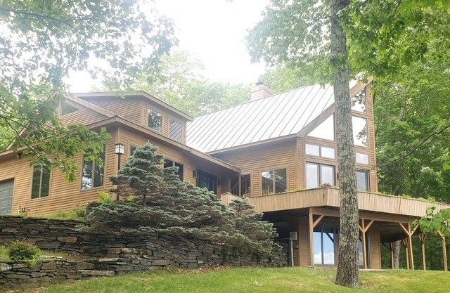 Spectacular mountain view home with a wraparound deck, washer/dryer, wet bar