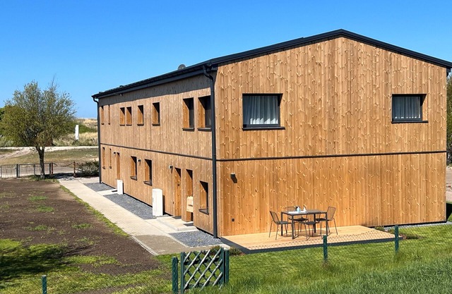 Strandnahe Ferienwohnung 1" avec terrasse privée, jardin privé et Wi-Fi.