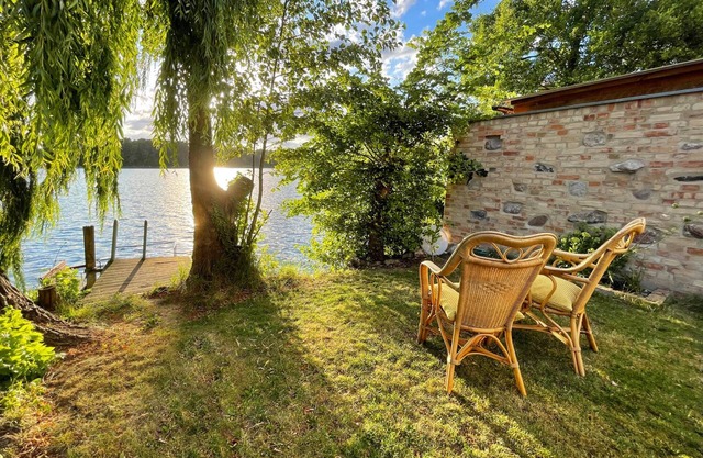Straushaus - Wellness hideaway directly on Straussee with sauna, pedal boat & fireplace
