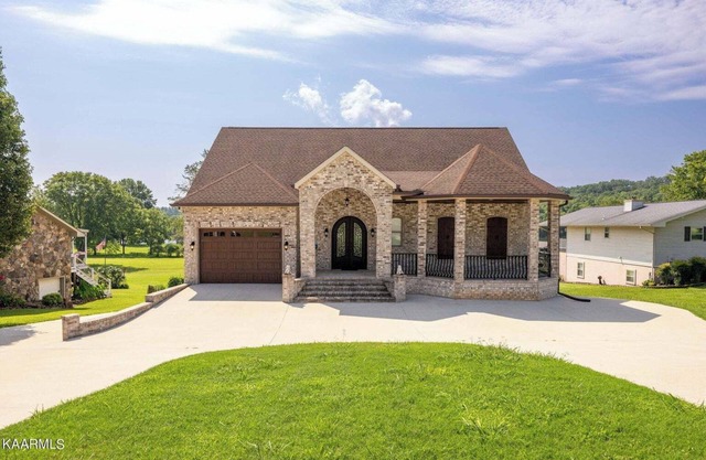 Stunning 4 bedroom lake front home in Spring City, Tennessee with all amenities.