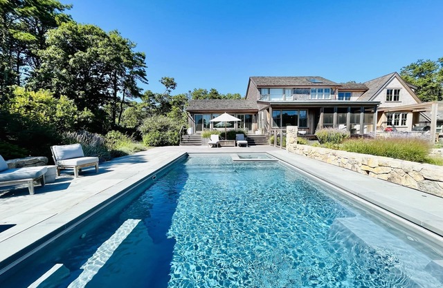 Stunning compound steps to Katama Bay, heated pool, dock & amenities