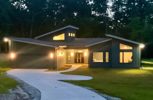 Stunning contemporary home in the woods; sauna, screened porch, soaring ceilings