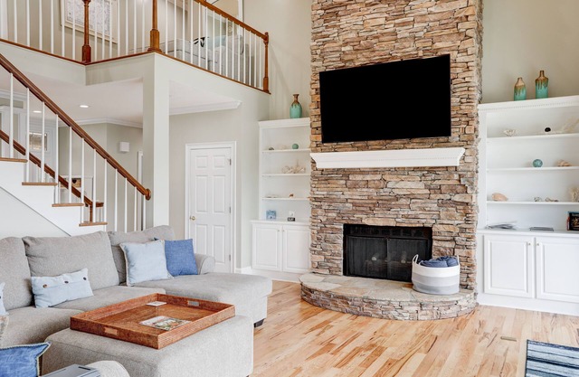 Stunning lakefront home with kayaks, dock, fireplace, game room, & washer/dryer