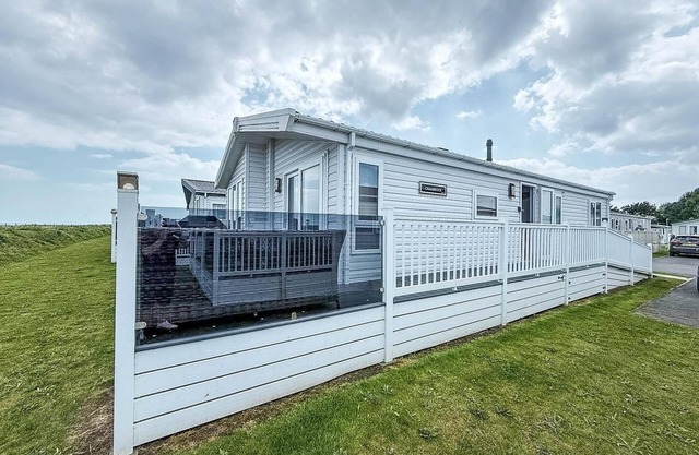 Stunning lodge with full sea views and decking at Broadland Sands ref 20076CF