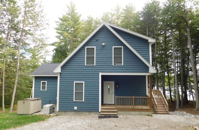 Stunning modern home in peaceful, private setting on desirable Long Lake.