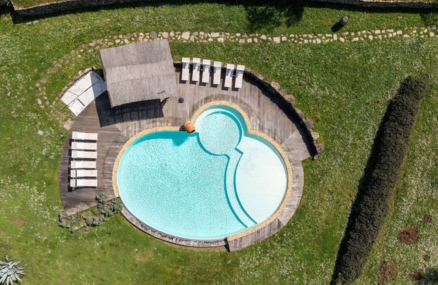 Maison de vacances privée avec bain à remous, climatisation, WIFI, piscine, TV, patio