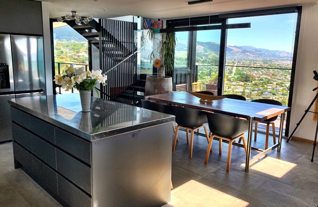 Stunning views, all-day sun, modern light filled home in a top Nelson area!