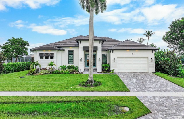 Stunning waterfront home w/ heated pool & hot tub
