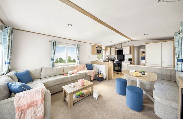 Stylish and modern caravan with one double and two twin.