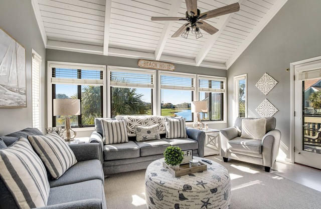 Stylish beach villa with pool, amenities, three decks, and golf course views