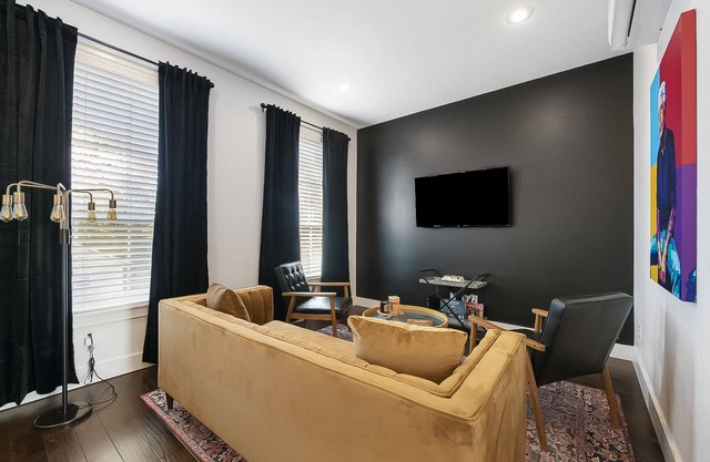 Stylish, dog-friendly condo with WiFi, board games, washer/dyer, & central AC