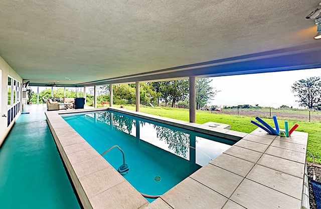 Stylish hillside retreat on 2 acres w/private pool, ocean & sunset views