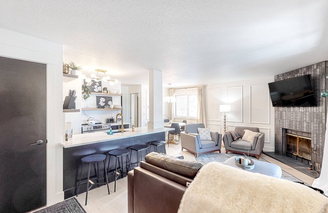 Stylish, lake view condo with fireplace & amazing location - walk to lake & town