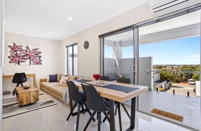 Stylish urban oasis with balcony & street views!