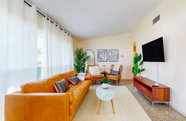 Sunlit & stylish dog-friendly retreat with great patio - steps from the shore