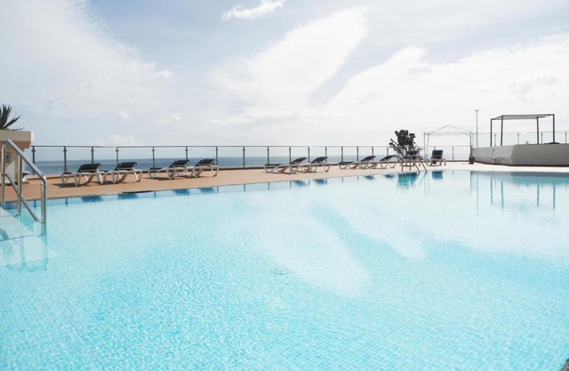 Sunny Apartment by the sea with a pool