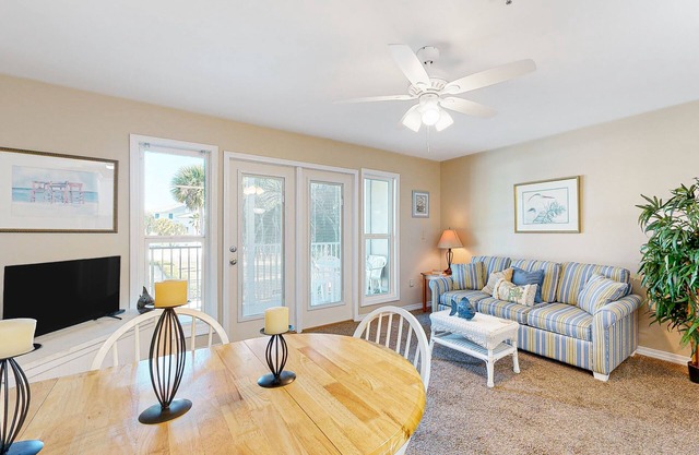 Sunny condo with pool, hot tub, pool views, balcony, & AC