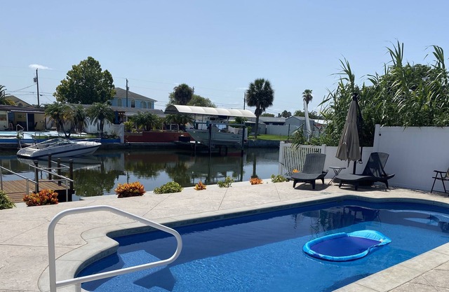 Sunny Waterfront Oasis! Private Pool, Hot Tub & Dock!