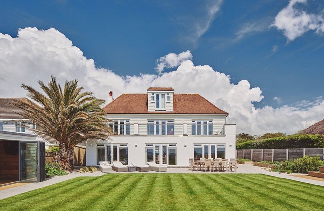Superb beach house with beautiful garden with hot tub and private beach access