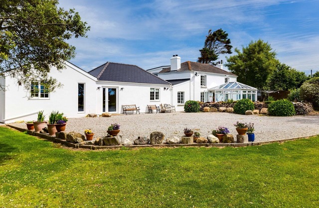 Surrounded by 2 acres of garden this is a haven for walkers, bird watchers and nature lovers.