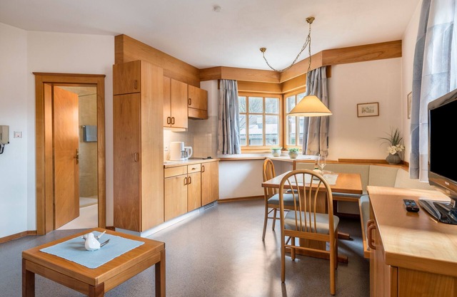 Appartement Taufner C 103 avec vue sur les montagnes, jardin et Wi-Fi.