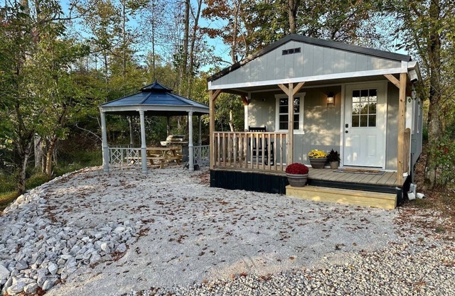 This tiny cabin is a peaceful place complete with stocked pond and kayaks!