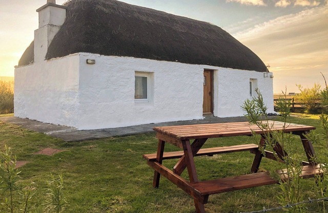 The cottage is so attractive with its traditional thatch and whitewashed walls.