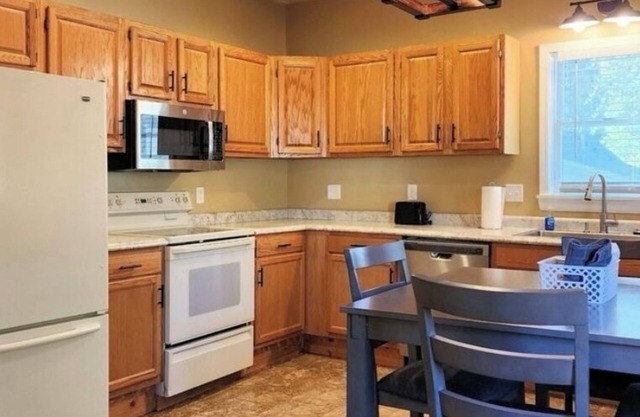 The Fairfax Farmhouse is a charming 3-bedroom house located in Bloomington.