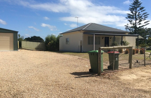 The Farmhouse Country Charm large yard Ample Parking Garage Available to use.